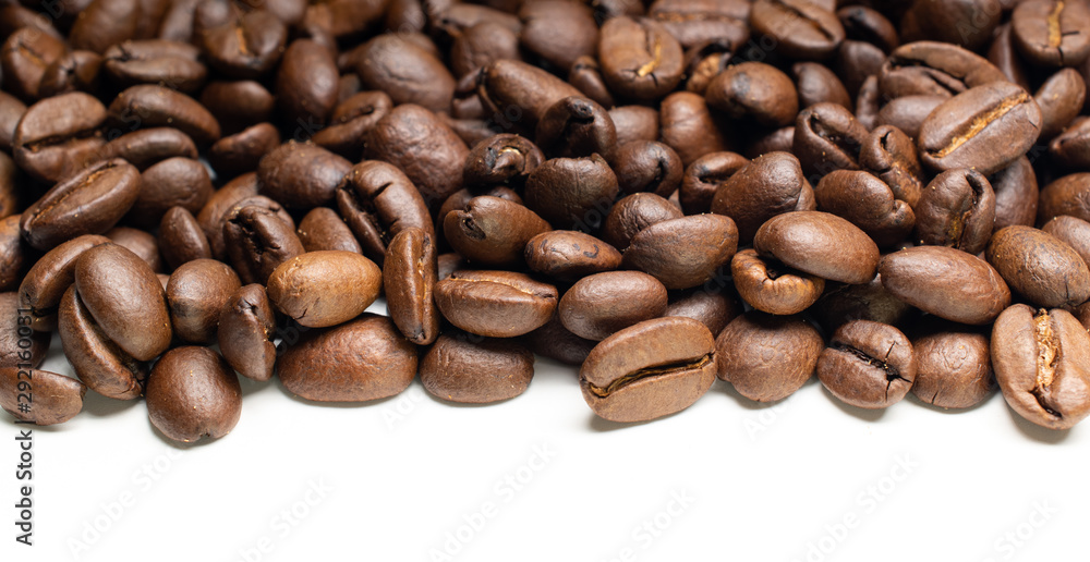 Fototapeta premium Roasted coffee beans on white
