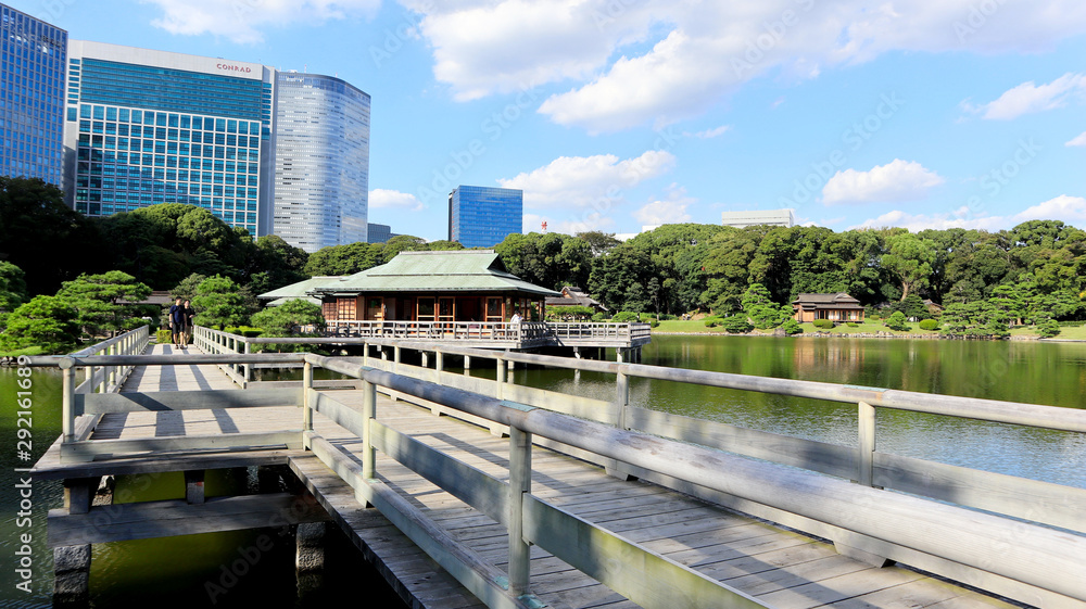 TOKYO, JAPAN. 2019 Sep 26th. View of Hamarikyu Japanese Garden and High-Rise Buildings. TOKYO, JAPAN. 2019 Sep 26th. View of Hamarikyu Japanese Garden and High-Rise Buildings.