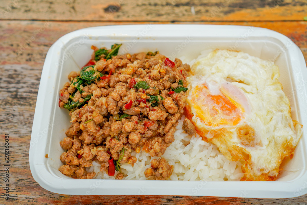 Stir fried Minced pork with basil,fast food Thai Style food. Thailand street food. Thailand's national dishes, Thai name is Pad kra prao Mou. famous food in Thailand Stir fried Minced pork with basil,fast food Thai Style food. Thailand street food. Thailand's national dishes, Thai name is Pad kra prao Mou. famous food in Thailand