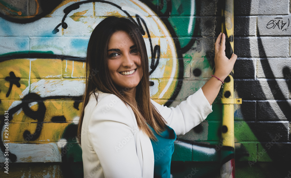 Smiling girl with colorful graffiti backgroung Smiling girl with colorful graffiti backgroung