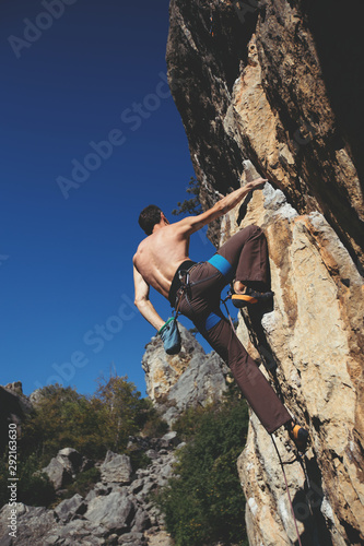 Man climbing a rock.