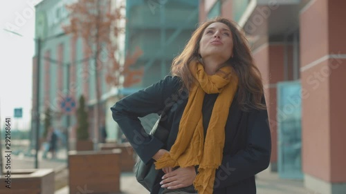 Close up young woman stand with stomach ache sneezing feel sick at outdoor fever cold allergy city beautiful disease female nose lady runny tissue air pollution adult illness district slow motion photo