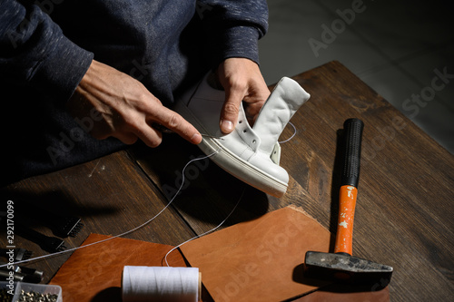 Men's shoes made of leather leather, the shoemaker workshop. shoemaker performs shoes