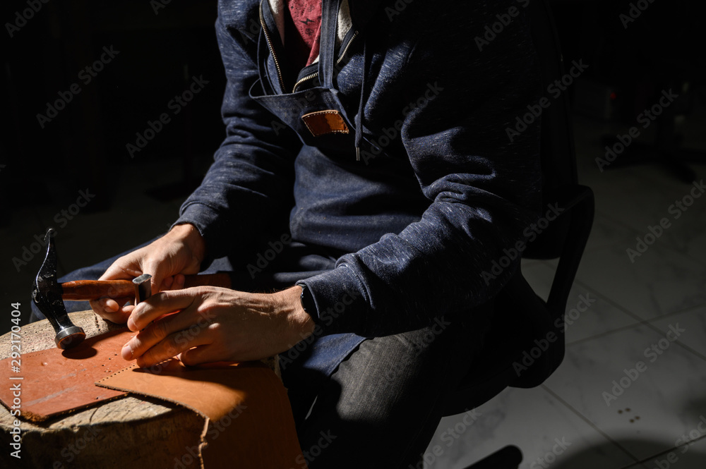 Fototapeta premium Leather Craftsman works at the tanner shop
