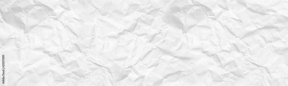 wide panorama crumpled paper texture background. crush paper so that it becomes creased and wrinkled. wide panorama crumpled paper texture background. crush paper so that it becomes creased and wrinkled.