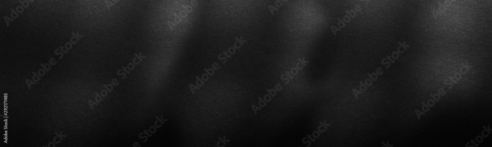 Panorama black paper texture or background with spotlight, dark wall backdrop wallpaper, dark tone.
