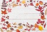 autumnal natural wooden background with autumn decoration