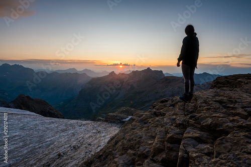 silhouette of a girl standing in front of Blümlisalpgletscher at Blümlisalphütte SAC