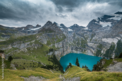 view of turquoise Lake Oeschinensee from high above in the Swiss Alps