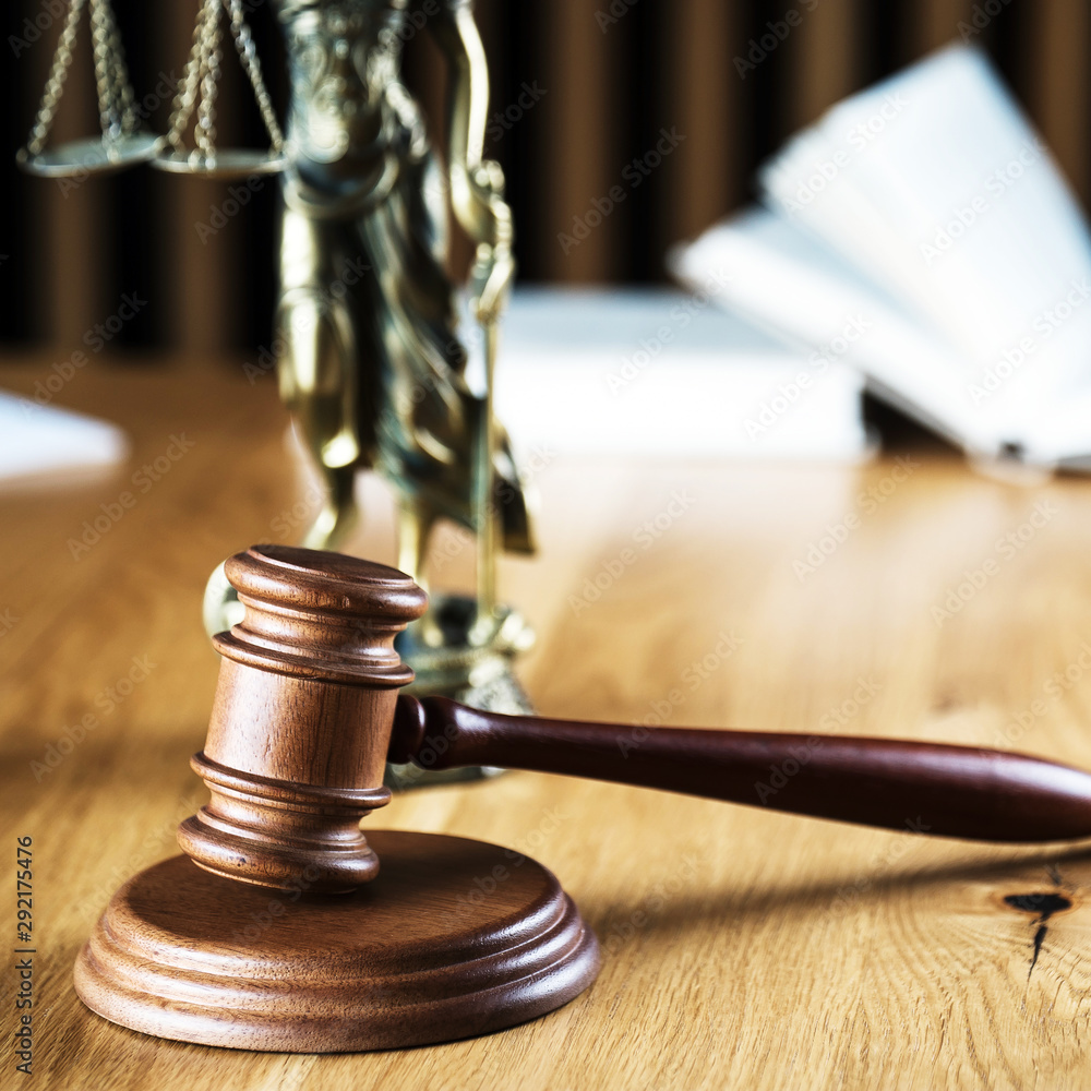 Law and Justice concept. Mallet of the judge, books, scales of justice. Gray stone background, reflections on the floor, place for typography. Courtroom theme. Law and Justice concept. Mallet of the judge, books, scales of justice. Gray stone background, reflections on the floor, place for typography. Courtroom theme.