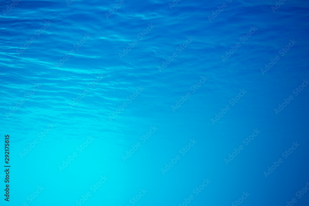 underwater background with sun ray and water ripple texture for your abstract design.