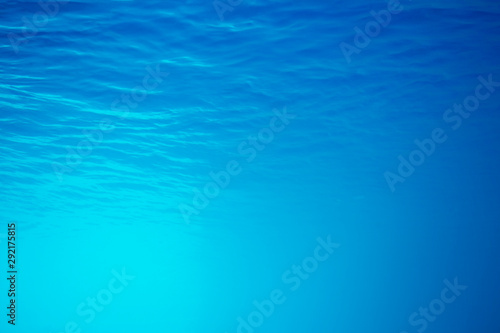 underwater background with sun ray and water ripple texture for your abstract design.