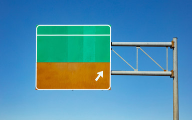 Blank road sign on the highway, clear blue sky background. USA.