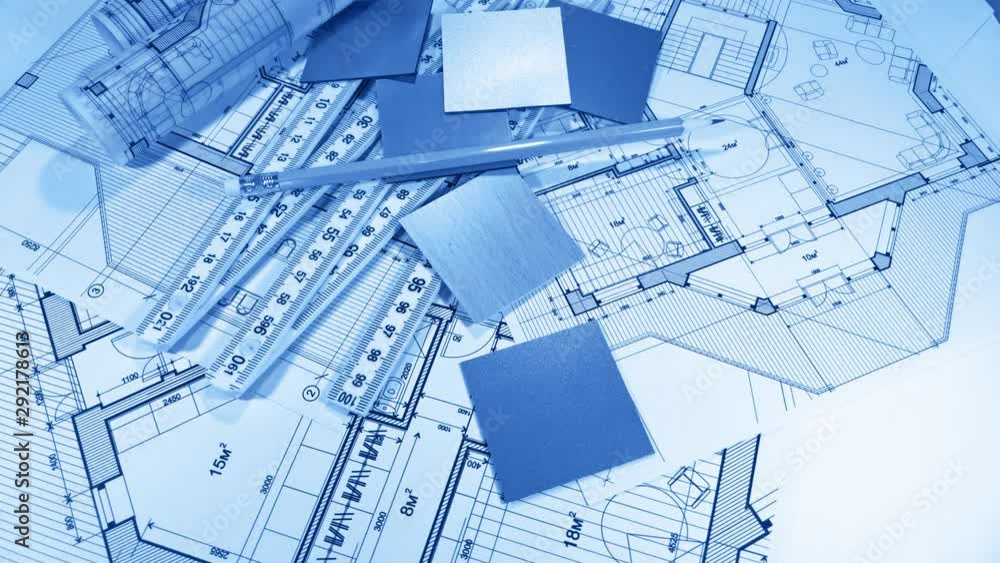 Blueprints: architectural drawings, yardstick - folding ruler & samples of modern interior decoration materials - decorative plastics smoothly rotate on the surface of the architectural plan Blueprints: architectural drawings, yardstick - folding ruler & samples of modern interior decoration materials - decorative plastics smoothly rotate on the surface of the architectural plan