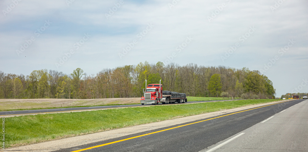 Truck on a highway in US, spring day