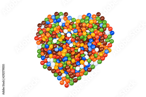 Heart made of multicolored candies isolated on white background.