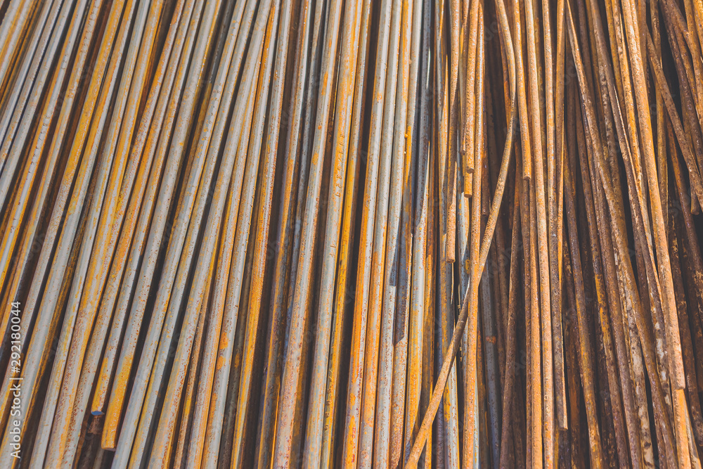 Background texture of old rusty steel bars construction materials in a construction site Background texture of old rusty steel bars construction materials in a construction site