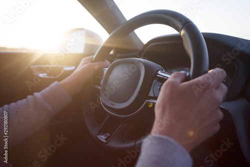 Man driving a car. Success in motion. Handsome young man driving a car. A man holds the steering wheel of a car. © as-artmedia