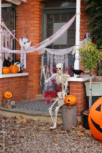Skeleton in a halloween house porch