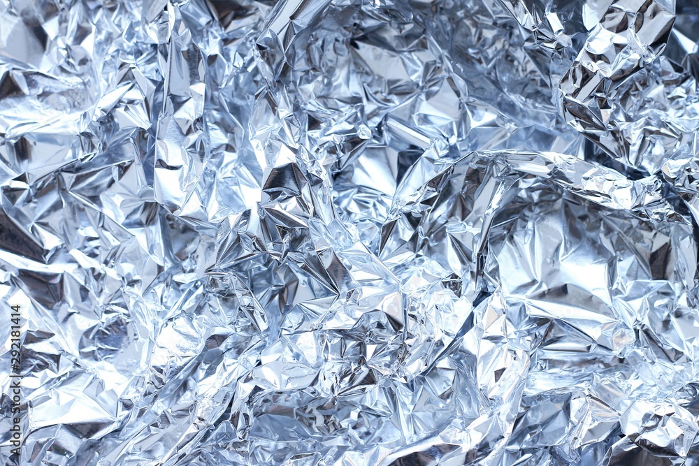 Abstract crumpled silver aluminum foil, close up background texture. Abstract crumpled silver aluminum foil, close up background texture.