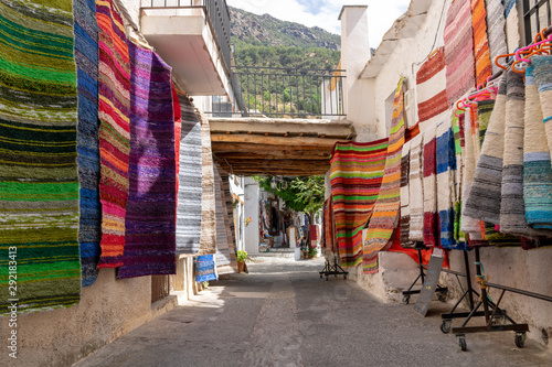 Colorful market street in a mediterranean village, Pampaneira. photo