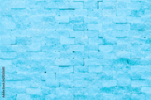 Wall of blue ice bricks and blocks background texture