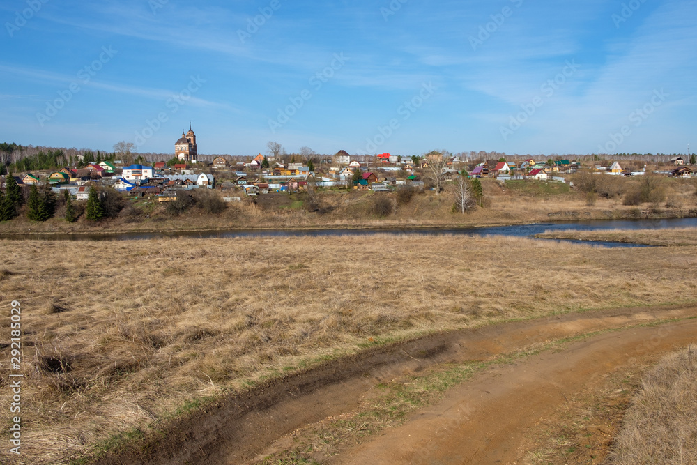 rural landscape and autumn field in the background old Church