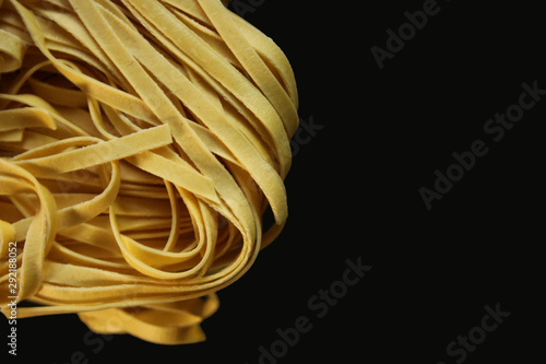 yellow spaghetti on a black background