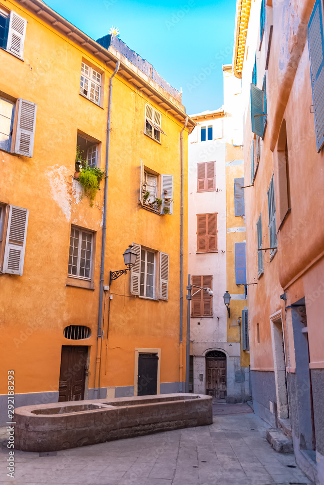 Fototapeta premium Nice, France, colorful facade, with typical windows and shutters, in a charming street 