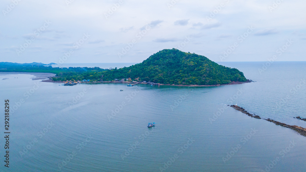 Aeril view of seascape of Chantaburi province, Thailand. Scenery consist of blue sea, blue sky with cloud, fisherman village along the bay. Aeril view of seascape of Chantaburi province, Thailand. Scenery consist of blue sea, blue sky with cloud, fisherman village along the bay.