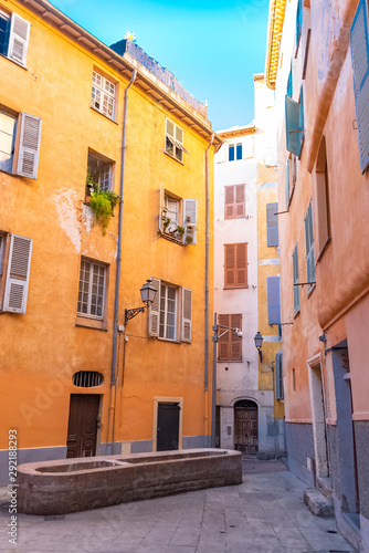 Nice, France, colorful facade, with typical windows and shutters, in a charming street 