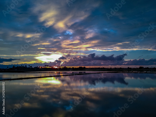 sunset over flooded paddy field in Penang, Malaysia