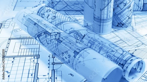 Blueprints - architectural drawings rolls smoothly rotate on the white surface / seamless looping	