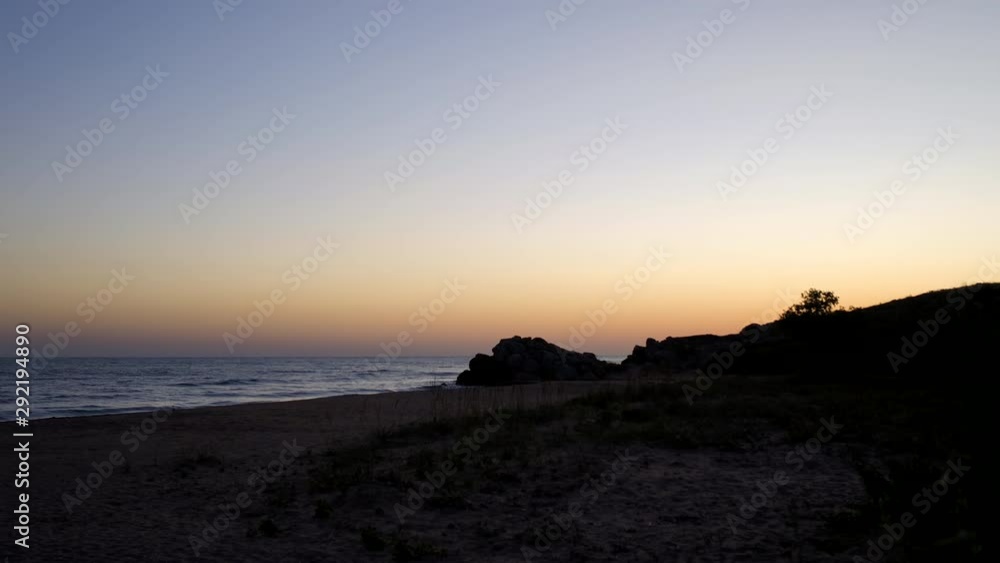 Sunrise on the beach. The sun rises from behind the mountains. Sunrise on the beach. The sun rises from behind the mountains.
