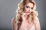 Beauty portrait of blonde beautiful woman with perfect makeup and hair style, isolated. Spa and hair, healthy skin