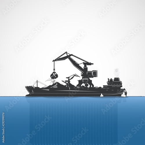 Moored bulk carrier and port crane.