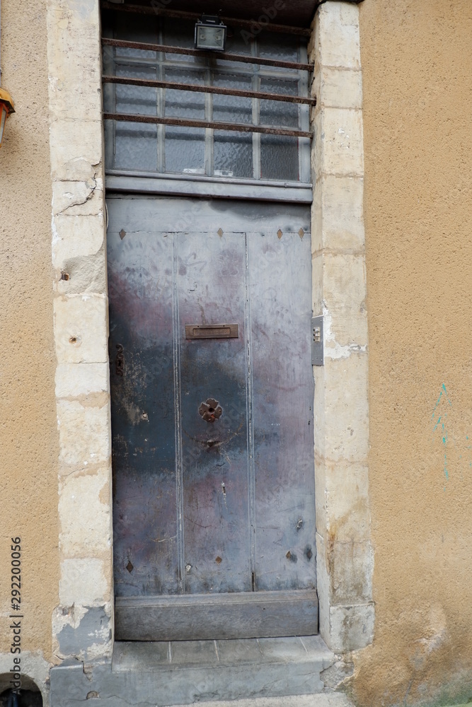 old wooden door in stone wall