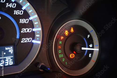 close-up of a dashboard with a speedometer in a car