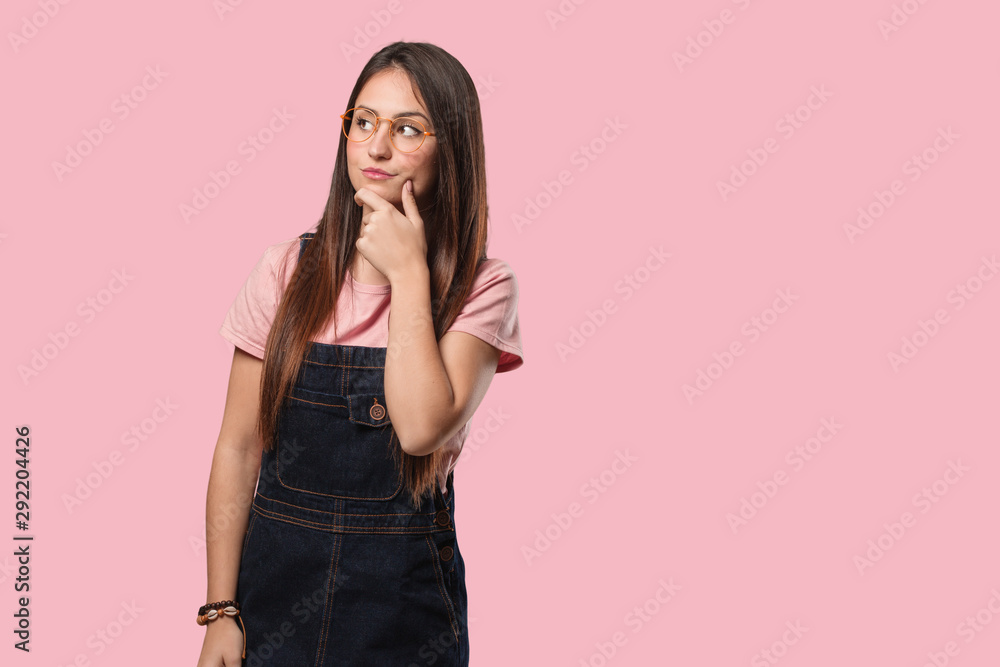 Young cool woman thinking about an idea Young cool woman thinking about an idea