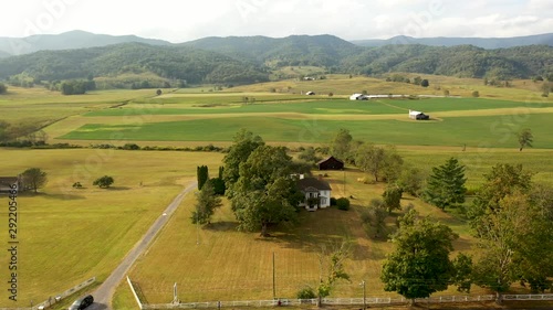 High aerial orbit to right in sun around the Pearl S. Buck birthplace museum in Hillsboro, West Virginia. photo