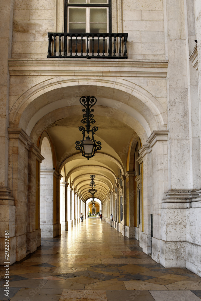 Lisbon, Portugal, arcades and archway of praca do comercio in Lisbon, Beautiful hallway and vintage lanterns hanging