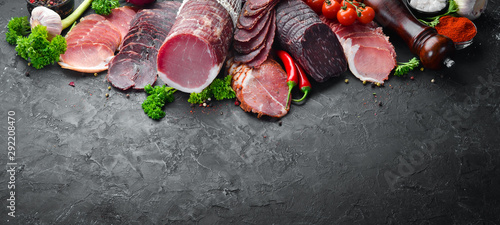Quadro su tela Set of smoked and dried meat Ham, jerky, salted biltong meat, spices and herbs