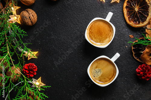 coffee  New Year  Christmas background or Noel holiday festive  nuts  cones  specials  decorations and gifts on the table  greeting card  winter menu concept. food background. copy space. Top view