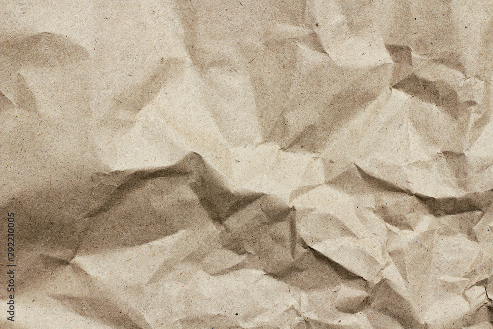 Naklejka premium Old dirty crumbled paper background texture. Vintage letter template. Creases and dents. Parchment. Wrapping process.