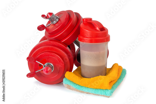 Fitness lifestyle concept. Dumbbells, towels, shaker with whey protein