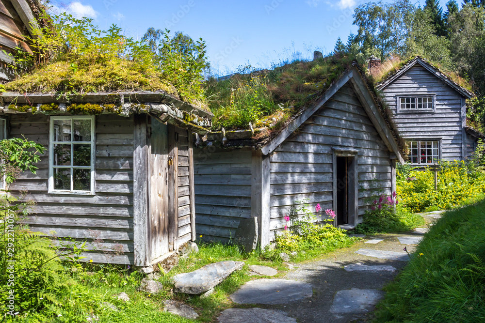 old wooden house on the lake in mountains