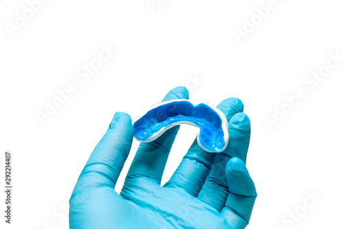 A white custom mouthguard for 6 old kid
