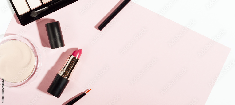 Makeup cosmetics top view on pink trendy background. Beauty elegant backdrop with copyspace. Eye shadows, lipstick, powder items for facial care. Women accessories. Fashion glamour composition. Makeup cosmetics top view on pink trendy background. Beauty elegant backdrop with copyspace. Eye shadows, lipstick, powder items for facial care. Women accessories. Fashion glamour composition.