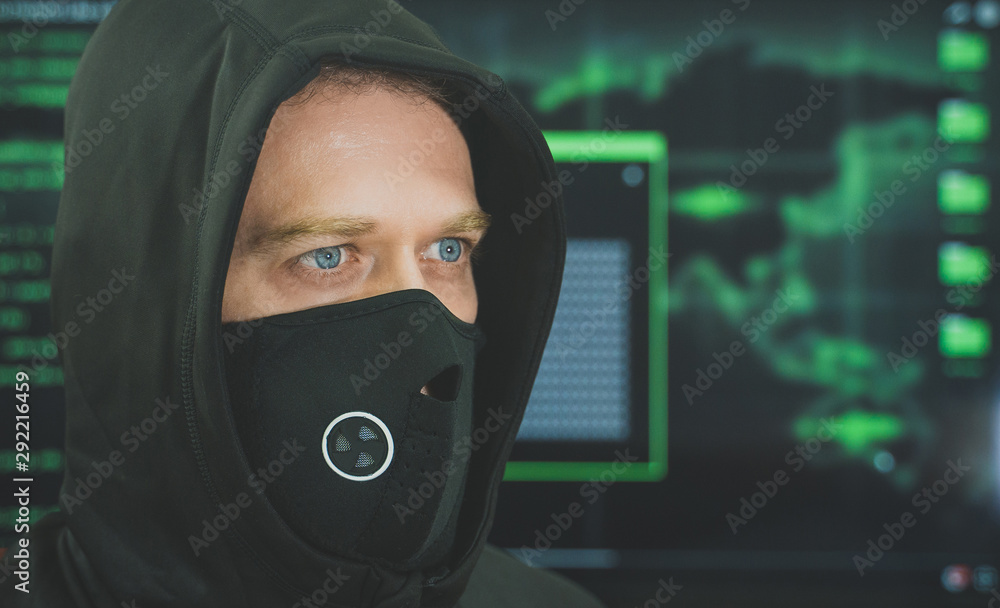 Hacker in black mask. Hacking and internet security concept. Hacker in black mask. Hacking and internet security concept.