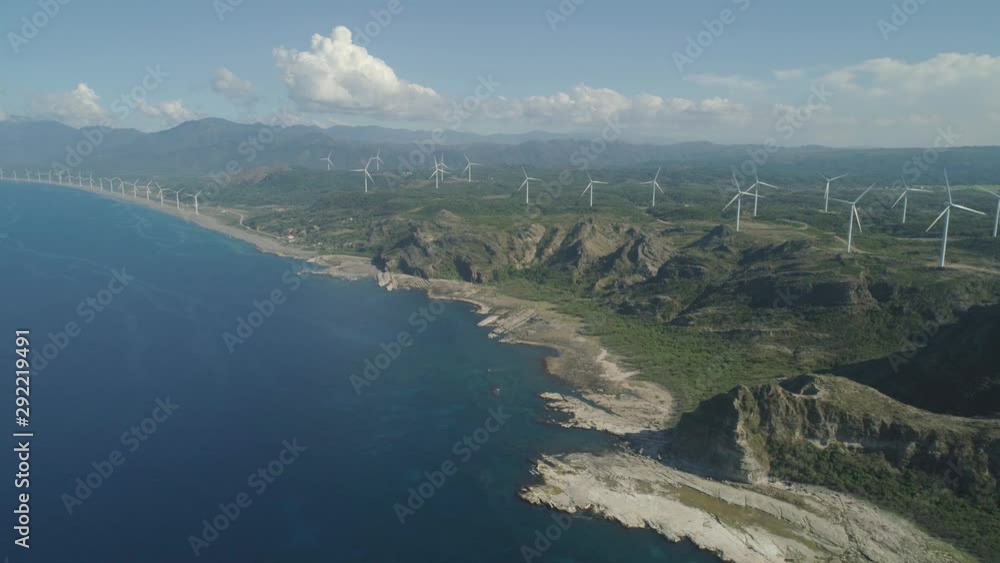 Aerial view of wind turbines, windmills for electric power production on the coast. Bangui Windmills in Ilocos Norte, Philippines. Ecological landscape: Windmills, sea, mountains. Pagudpud Aerial view of wind turbines, windmills for electric power production on the coast. Bangui Windmills in Ilocos Norte, Philippines. Ecological landscape: Windmills, sea, mountains. Pagudpud
